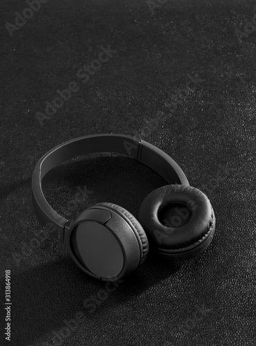 Black wireless headphones on desk