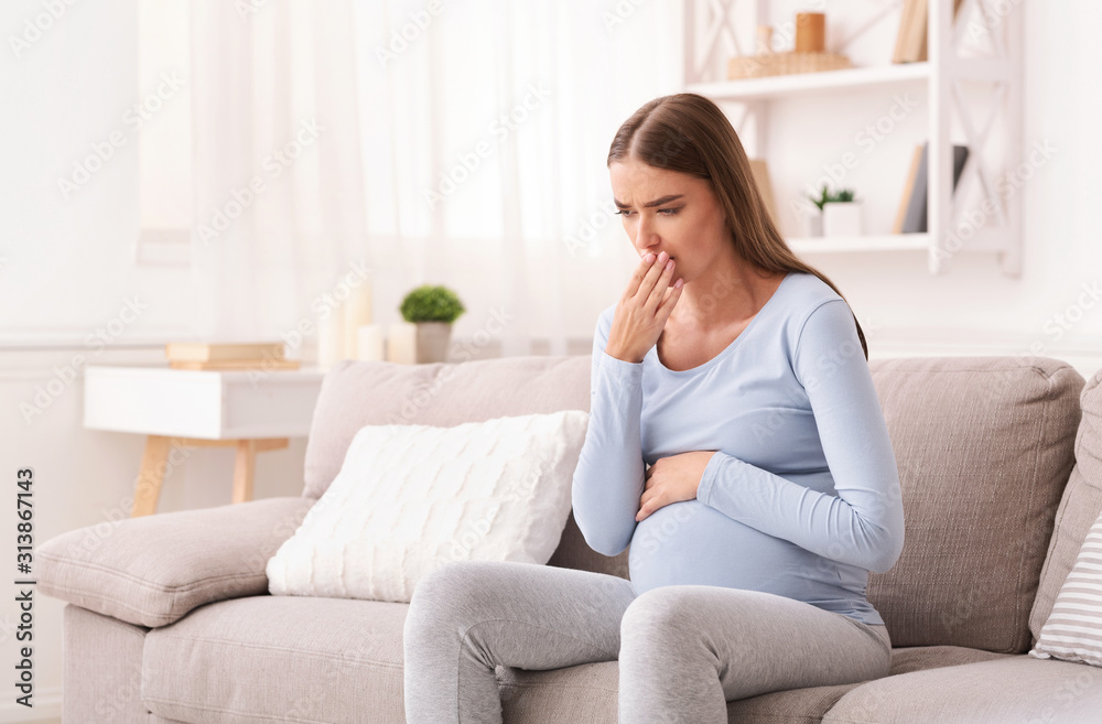 Pregnant Lady Feeling Sick Sitting On Sofa Indoor Pregnant Lady Feeling Sick Sitting On Sofa Indoor