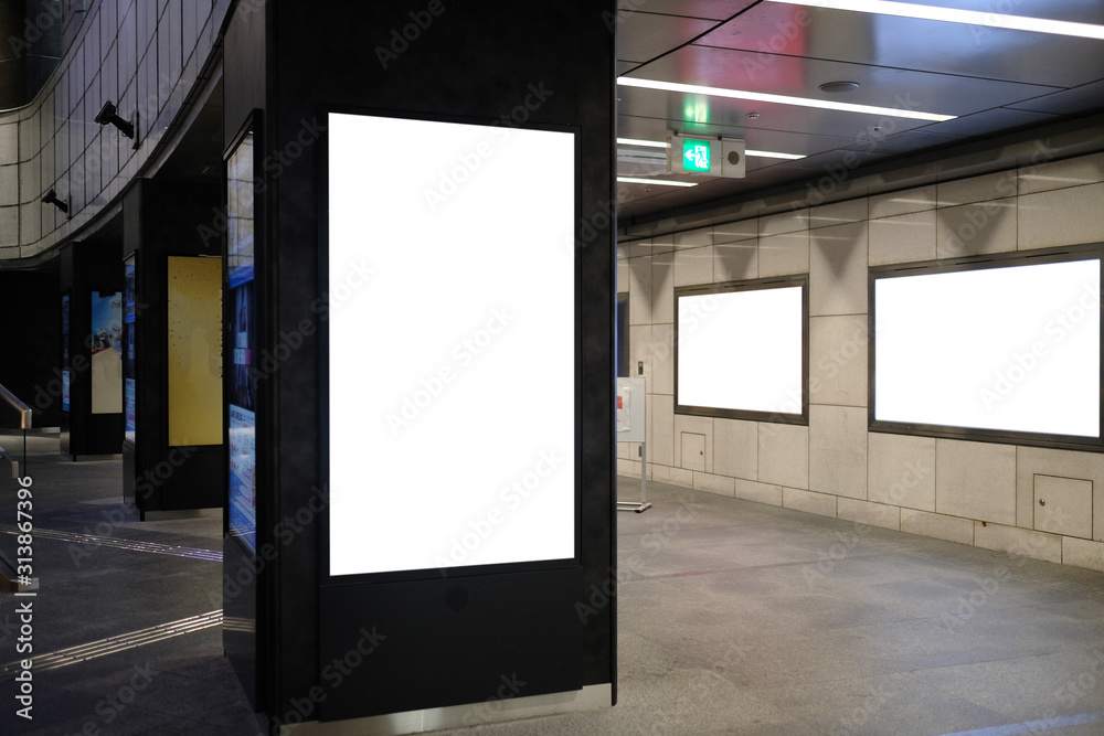 Blank billboard mockup near to escalator in an mall, shopping center, airport terminal, office building or subway station. Blank billboard mockup near to escalator in an mall, shopping center, airport terminal, office building or subway station.