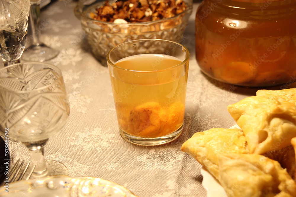 compote with stewed fruit in glass on festive table compote with stewed fruit in glass on festive table