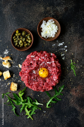 Billede på lærred Beef tartare - traditional dish of french cuisine.Top view.