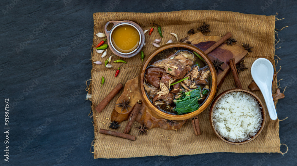 Stewed leg pork with Sweet gravy sauce with Served with jasmine rice , Chinese food, Selective focus and toned image. Stewed leg pork with Sweet gravy sauce with Served with jasmine rice , Chinese food, Selective focus and toned image.