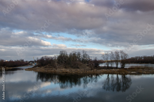 reflection of clouds in lake © Andrey