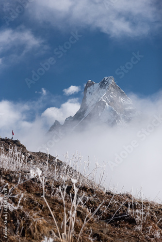 Nepal , Mardi himal : Stuning scenic viewpoint landmark of Madi himal viewpoint at 4200 m. above the sea  with Macchapucchre mountain in Annapurna Conservation Area , Nepal photo