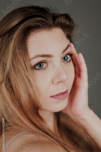 portrait of blonde girl with blue eyes and big bokeh