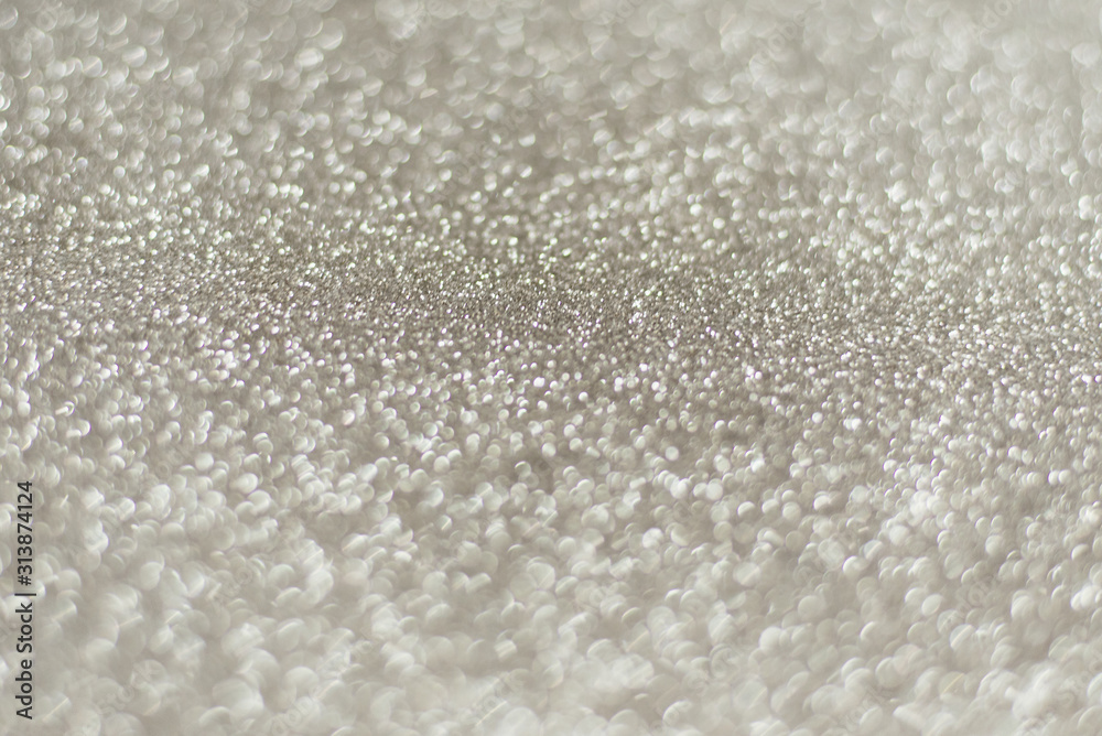Silver background Abstract Bokeh Christmas. Shiny silver glitter background with copy space Silver background Abstract Bokeh Christmas. Shiny silver glitter background with copy space