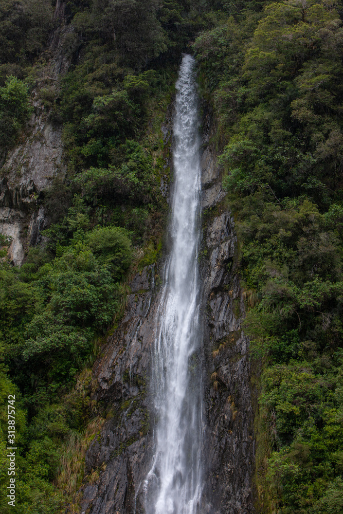 Thunder Creek Falls. Haast Makarora Pass Highway. South Island New Zealand. River and rocks