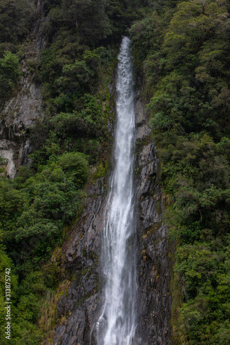 Thunder Creek Falls. Haast Makarora Pass Highway. South Island New Zealand. River and rocks © A