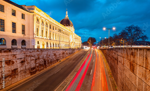 Long exposure photo of Grand Hotel Dieu with traffic on the move