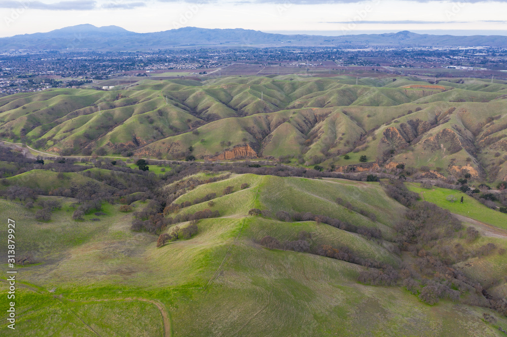 Seen from a bird's eye view, the hills near the Tri-Valley region, just east from Oakland and San Francisco, have turned green after winter rains. This beautiful area is known for its wineries.