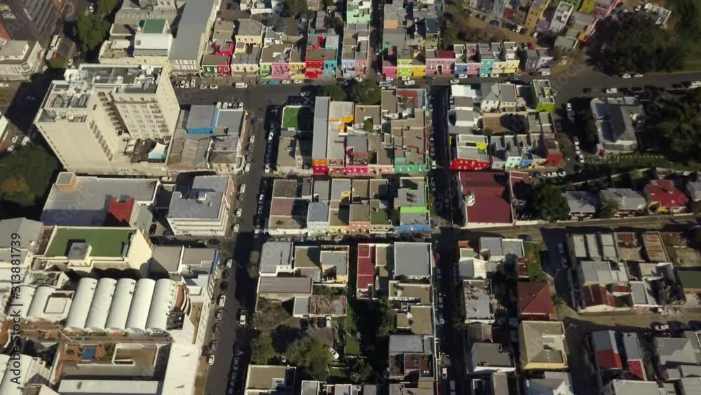 Scenic aerial wide drone shot above Bo-Kaap, Cape Town, South Africa. Tilt-up with scenic view of Bokaap, Oranjezicht, downtown business area and Table Mountain. Establishing shot with copy space, Scenic aerial wide drone shot above Bo-Kaap, Cape Town, South Africa. Tilt-up with scenic view of Bokaap, Oranjezicht, downtown business area and Table Mountain. Establishing shot with copy space,