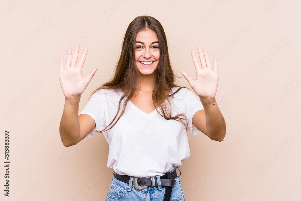 Young caucasian woman posing isolated showing number ten with hands. Young caucasian woman posing isolated showing number ten with hands.