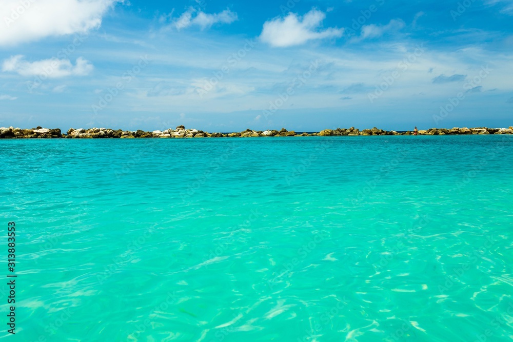 Beautiful view of coast line of Atlantic ocean.Turquoise sea water and blue sky. Curacao island.. Beautiful nature background.