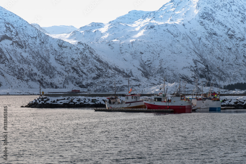 Docks in the harbor in the bay of Lofoten Island during the winter