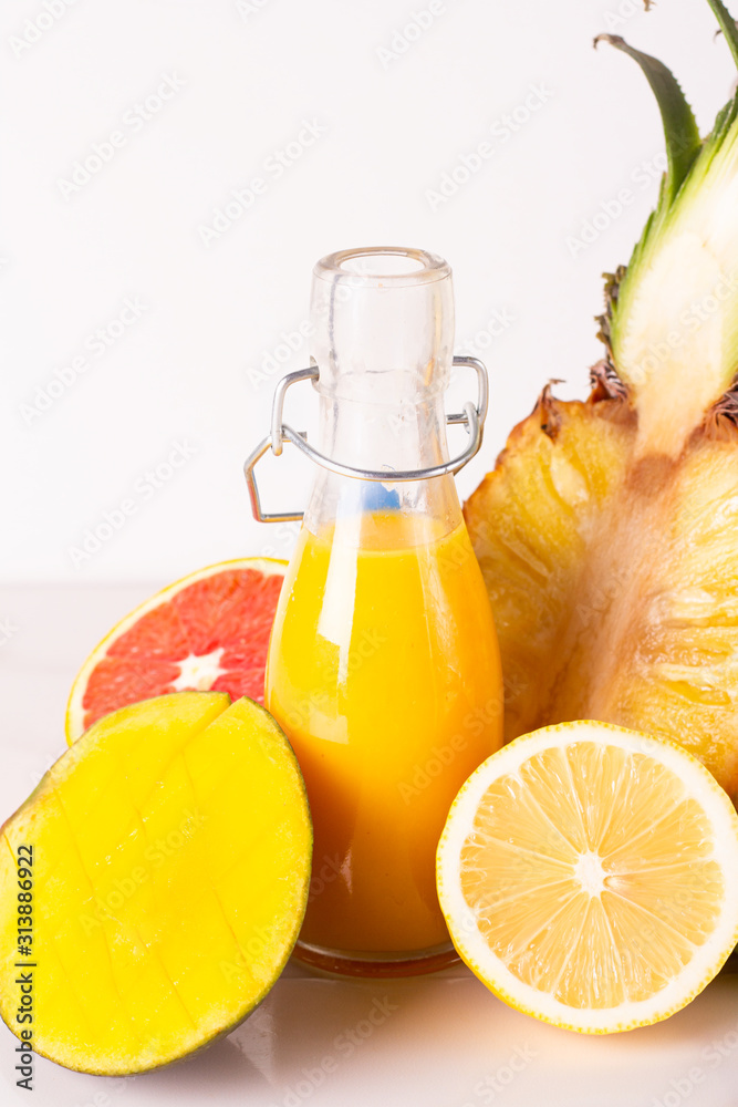 bottle with juice and fruits close-up bottle with juice and fruits close-up