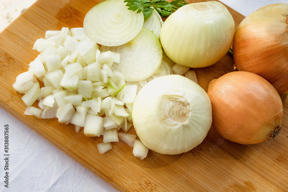 Chopped onions on wooden board Chopped onions on wooden board