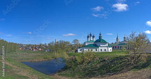 Spring sunny day. View of the old Russian city from the Kremlin ramparts. The Golden Ring of Russia, Suzdal.