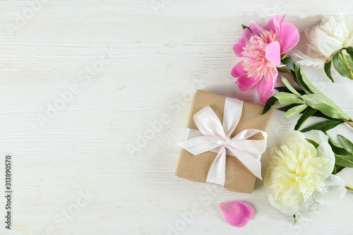 Beautiful peony flowers closeup over textured background with a lot of copy space for text. International women s mother s valentine s first spring day. Close up  top view  backdrop  flat lay.