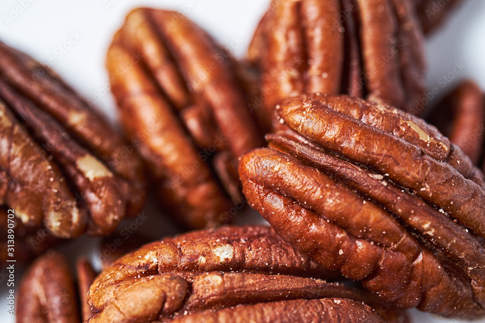 pecans on a white background pecans on a white background