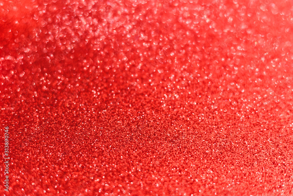 Red glitter background texture for Valentines day, Christmas, New Year wallpaper decoration, wedding invitation card. Abstract sparkling shiny wrapping paper background, copy space, defocused lights.