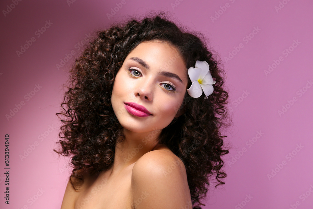 Beautiful woman with with light make up and curly hairstyle wearing shoulderless dress. Beautiful woman with with light make up and curly hairstyle wearing shoulderless dress.