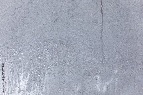The texture of fogged glass in a warm room