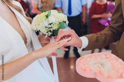 newlyweds append signatures in a registry office during wedding registration. photo