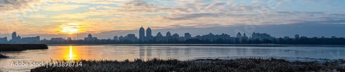 Panoramic landscape view of Dnipro river and its Right bank of Obolon district at winter sunset, Kyiv 