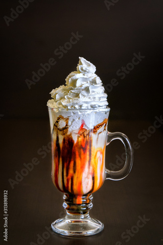 Glass of milkshake with whipped cream