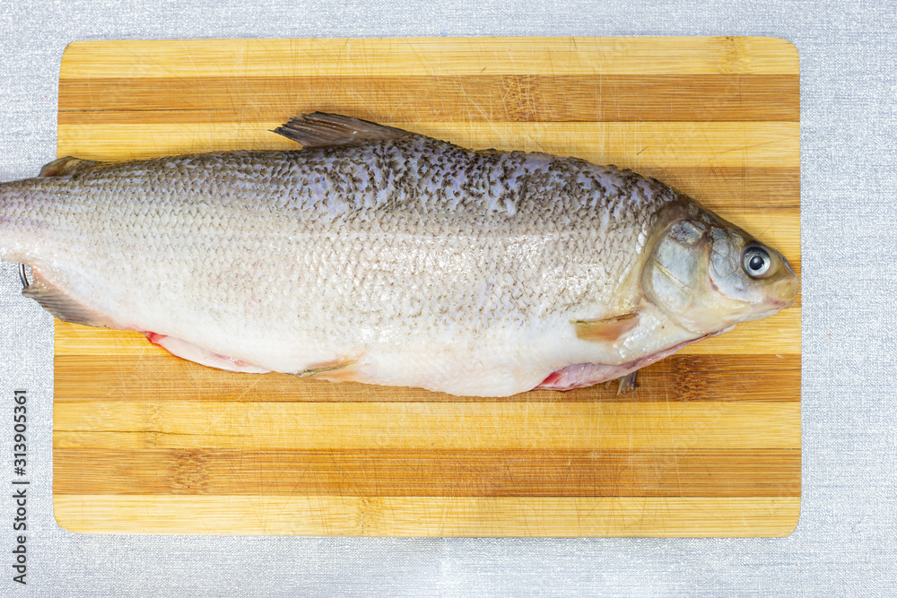 cooking fish cheeks in the kitchen, raw product cooking fish cheeks in the kitchen, raw product