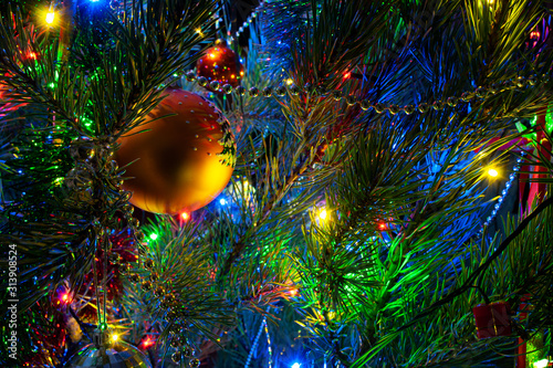 beautiful yellow ball on christmas tree