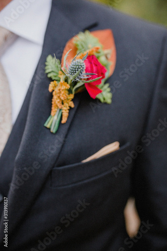 boutonniere groom black suit modern