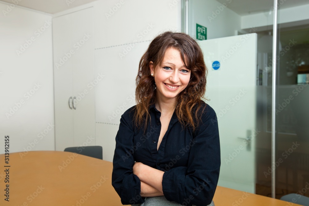Proud businesswoman sitting in her board room Proud businesswoman sitting in her board room