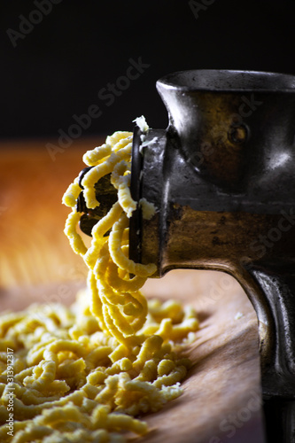 Making Italian traditional handmade and homemade passatelli pasta photo