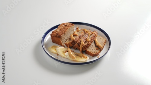 Sliced banana bread, peanut butter and banana