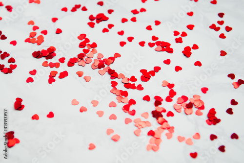 Valentine's day background - red paper herts on white background close-up