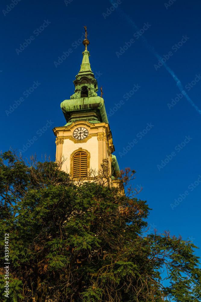 Baroque tower of church in early morning light.