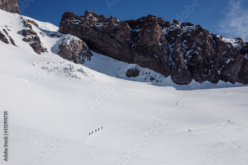 Climbing Teams Descend a Trail Above Camp Muir on Mount Rainier photo