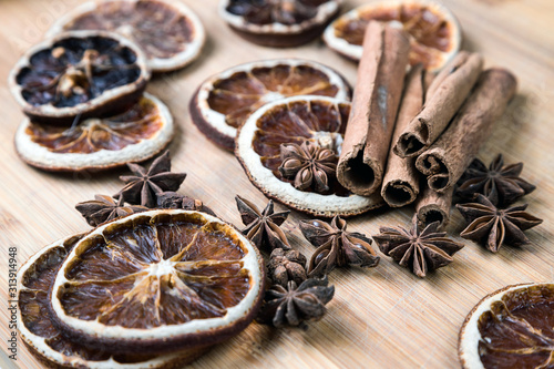 Dried citrus fruits with cinnamon, star anise on white background. Mulled Wine Ingredients.