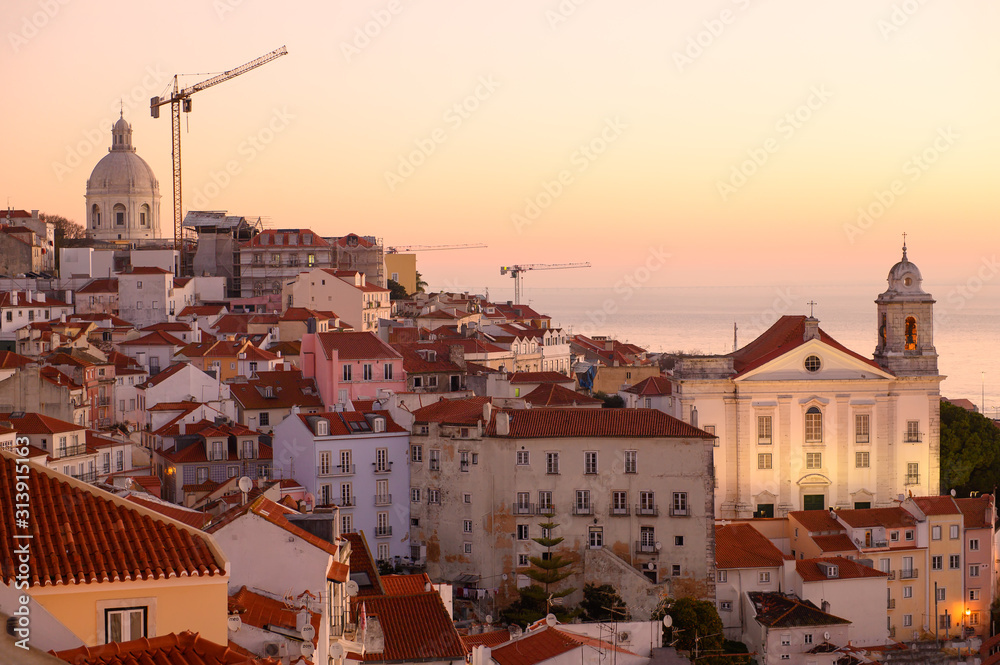 Fototapeta premium Lisbon, Portugal. December 30, 2019. Lisbon old town. View of the Pantheon and the church. Dawn Lisbon.