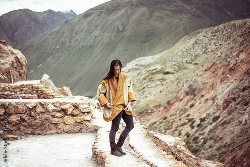 Androgynous mixed race dancer  in salt farm on mountain side photo