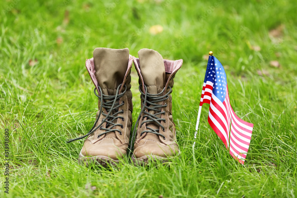 Military boots and USA flag outdoors. Memorial Day celebration Stock ...