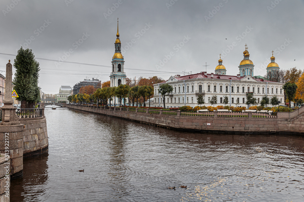 Autumn view of the St. Nicholas-Epiphany Sea Cathedral from the Griboyedov canal embankment, St. Petersburg, Russia. Autumn view of the St. Nicholas-Epiphany Sea Cathedral from the Griboyedov canal embankment, St. Petersburg, Russia.