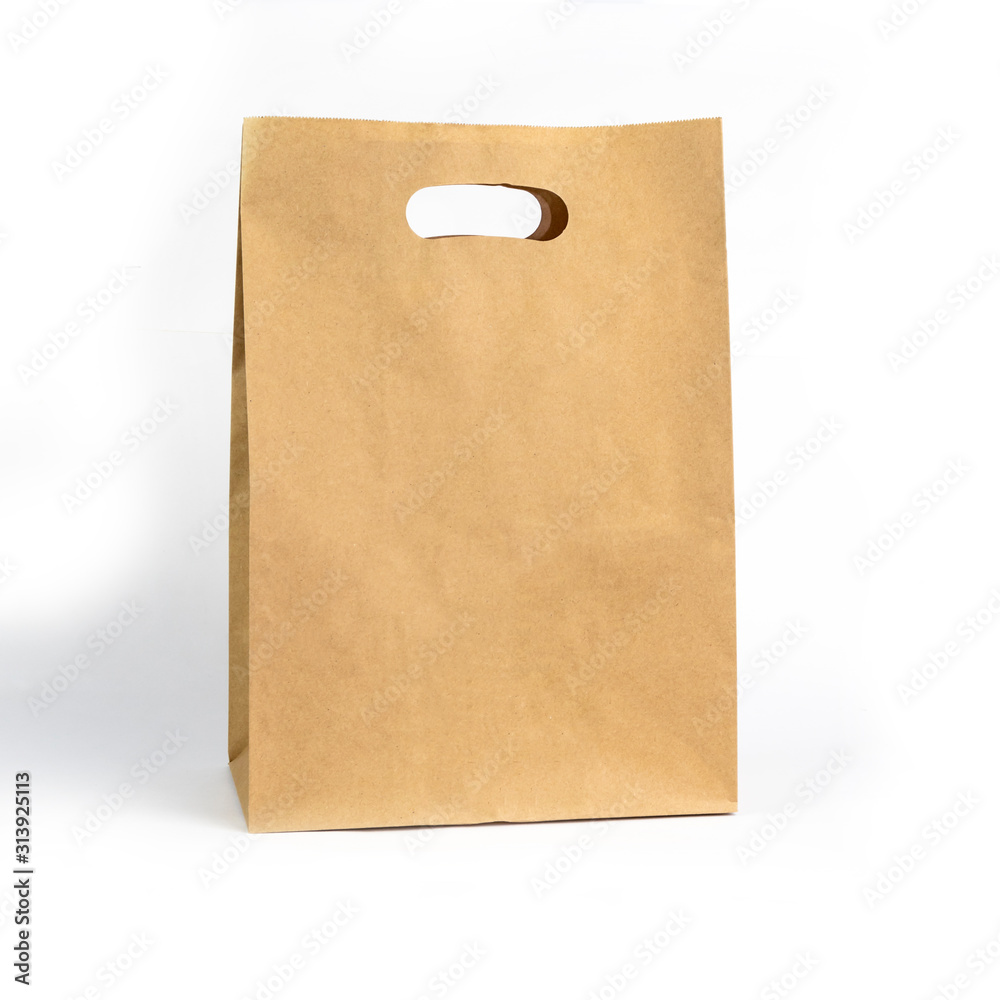 gray paper bag on a white background. concept of rejection of plastic bags. close-up. gray paper bag on a white background. concept of rejection of plastic bags. close-up.
