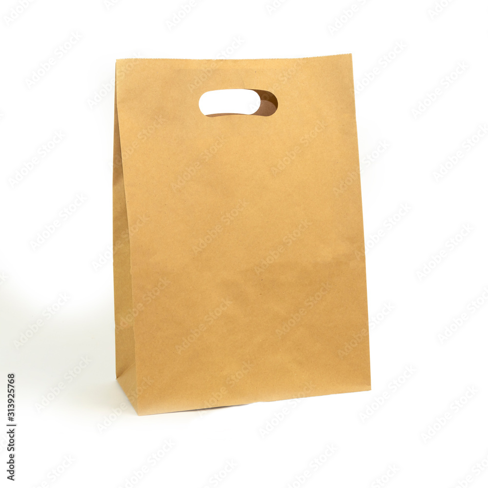 gray paper bag on a white background. concept of rejection of plastic bags. close-up. gray paper bag on a white background. concept of rejection of plastic bags. close-up.