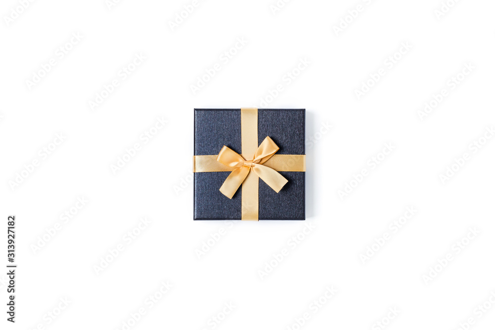 Holiday card. Grey gift box with gold bow on isolated white background. Flat lay, top view, copy space. Holiday card. Grey gift box with gold bow on isolated white background. Flat lay, top view, copy space.