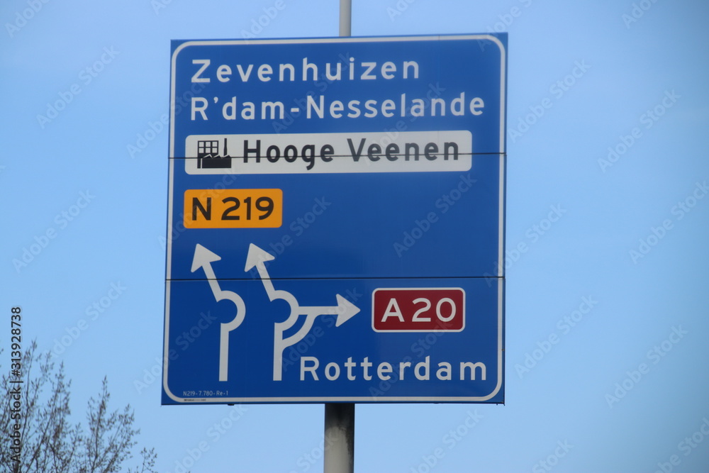 Blue direction signs at regional road N219 between Nieuwerkerk and Zevenhuizen in the Netherlands Blue direction signs at regional road N219 between Nieuwerkerk and Zevenhuizen in the Netherlands