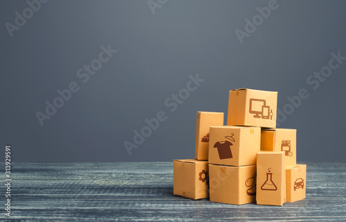 Stock pile of cardboard boxes. Production goods and products, distribution and trade exchange goods, retail sales. Global business, import, export. Freight transportation. Logistics and warehousing. photo