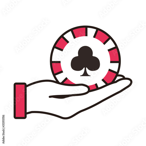 hand lifting casino chip with clover isolated icon