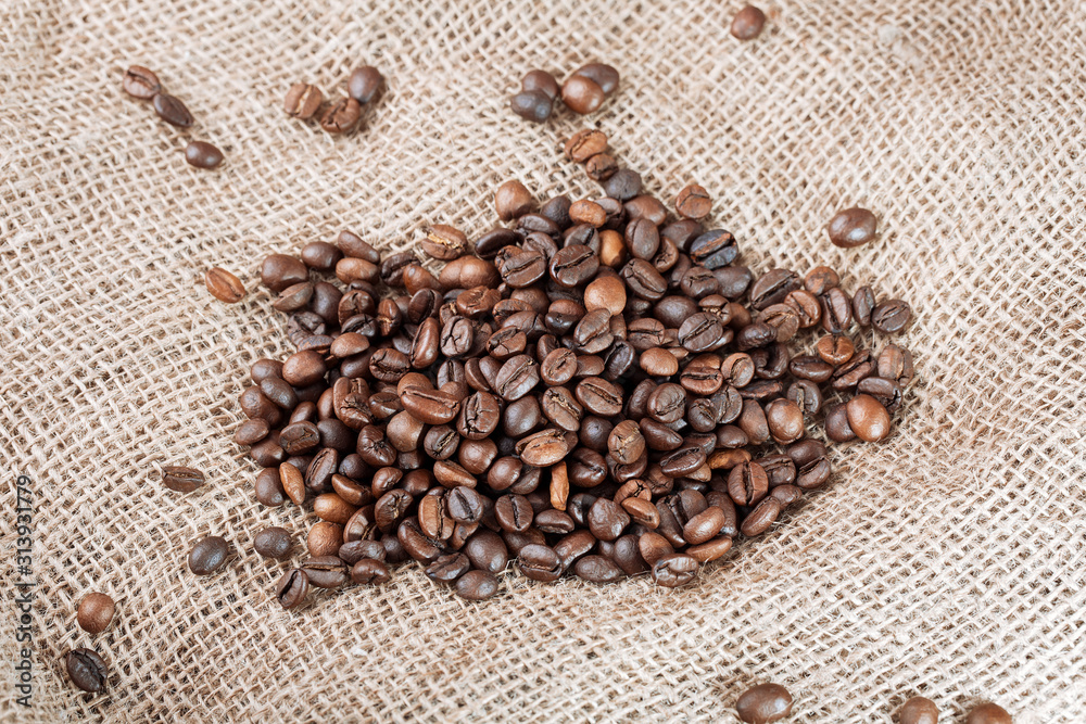 Coffee beans on sackcloth background. Roasted coffee beans, can be used as a background Coffee beans on sackcloth background. Roasted coffee beans, can be used as a background